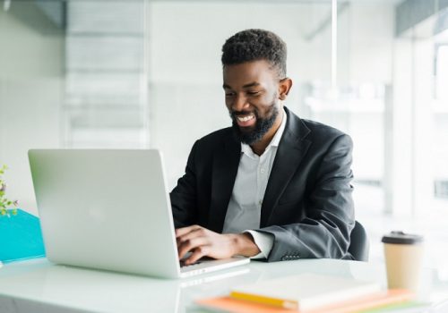 thoughtful-african-american-businessman-using-laptop-pondering-project-business-strategy-puzzled-employee-executive-looking-laptop-screen-reading-email-making-decision-office